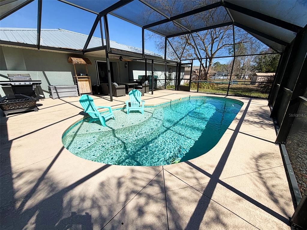 16 Powder Hill Lane Palm Coast, FL 32164 - Photo 2 of 27 a view of a swimming pool with a patio
