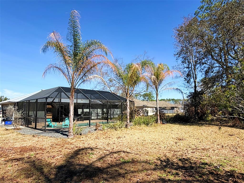 16 Powder Hill Lane Palm Coast, FL 32164 - Photo 21 of 27 a view of a house with a yard