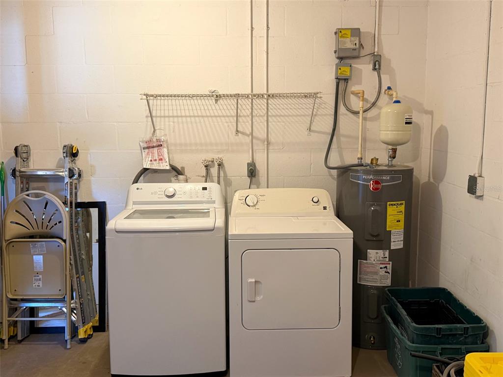 16 Powder Hill Lane Palm Coast, FL 32164 - Photo 23 of 27 a utility room with dryer and washer