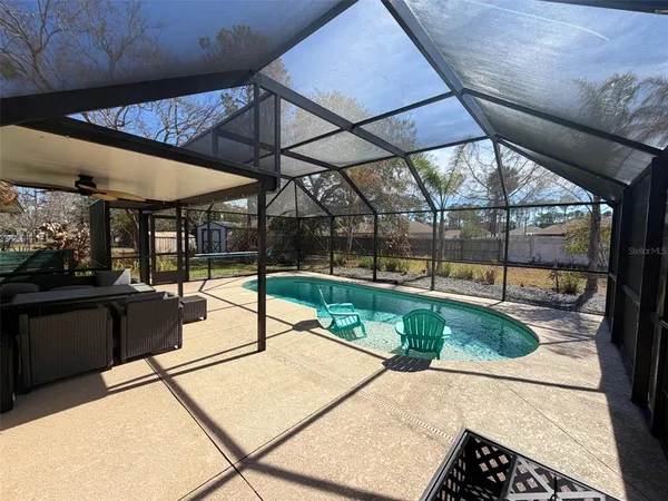 a view of a backyard with a patio
