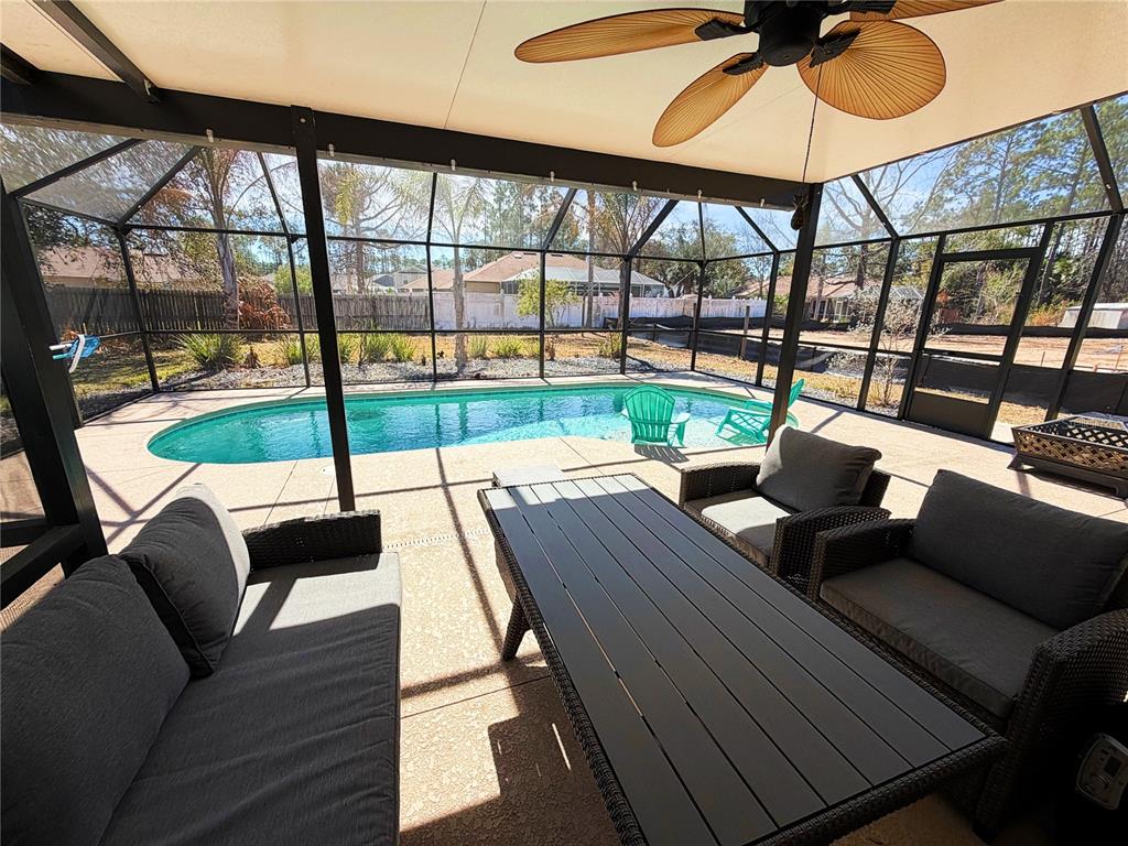 16 Powder Hill Lane Palm Coast, FL 32164 - Photo 3 of 27 a living room with furniture and a large window