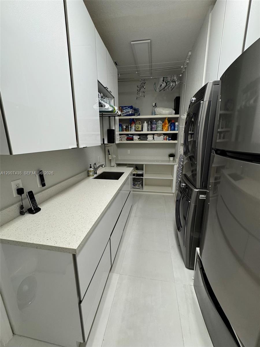 15053 Southwest 40th Street Davie, FL 33331 - Photo 29 of 36 Laundry room with TV on opposite wall (not in picture)