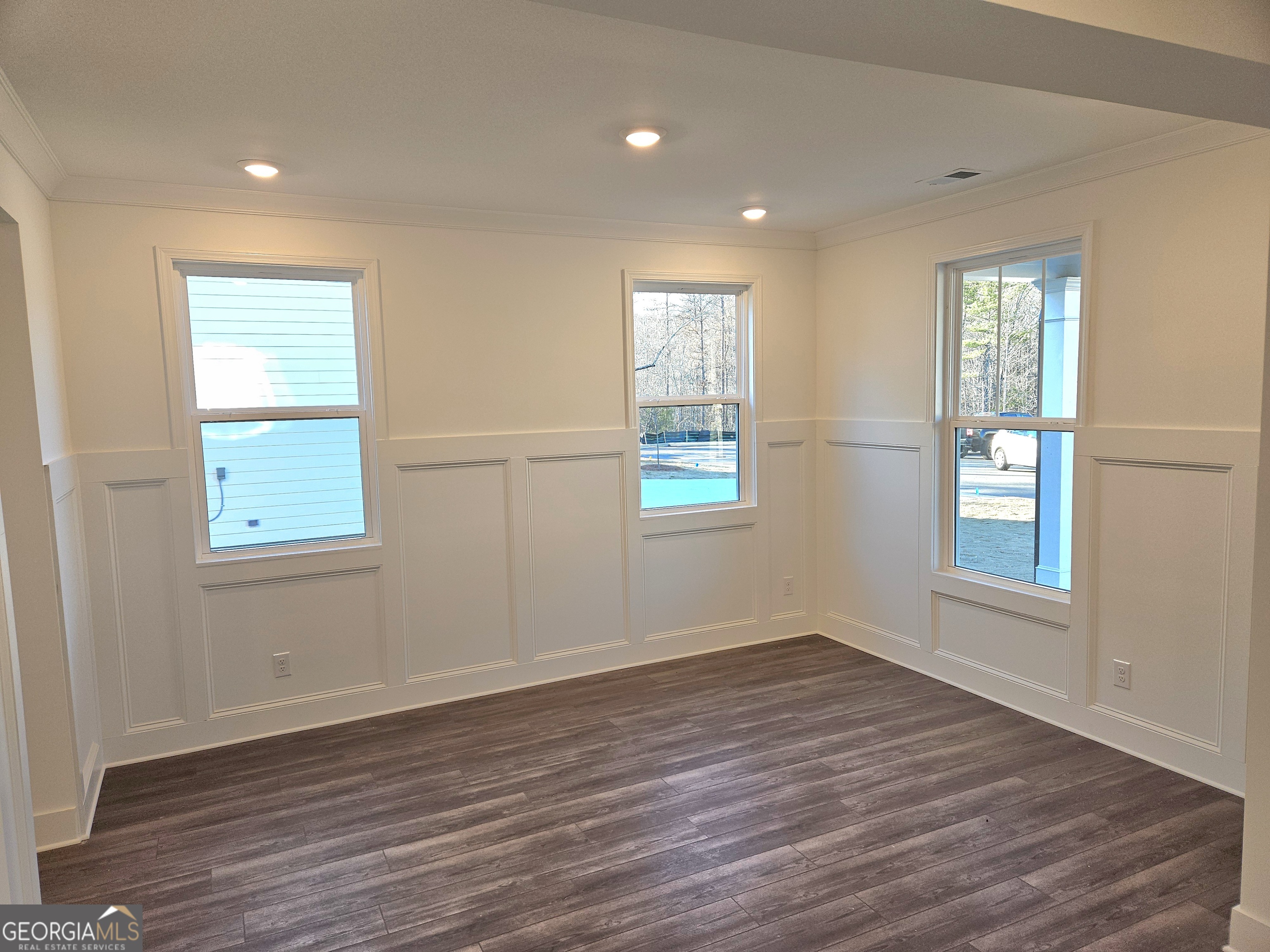 219 Andalusa Court Dallas, GA 30132 - Photo 13 of 50 an empty room with wooden floor and windows