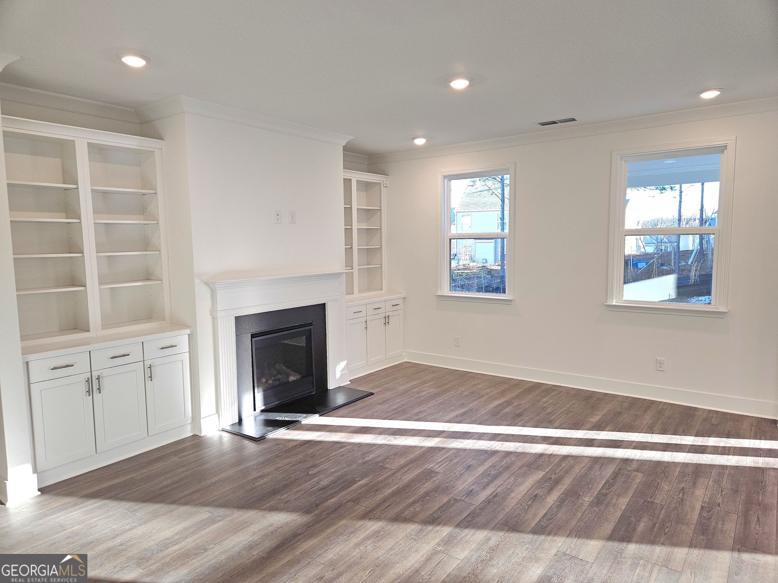 219 Andalusa Court Dallas, GA 30132 - Photo 14 of 50 an empty room with windows and fireplace