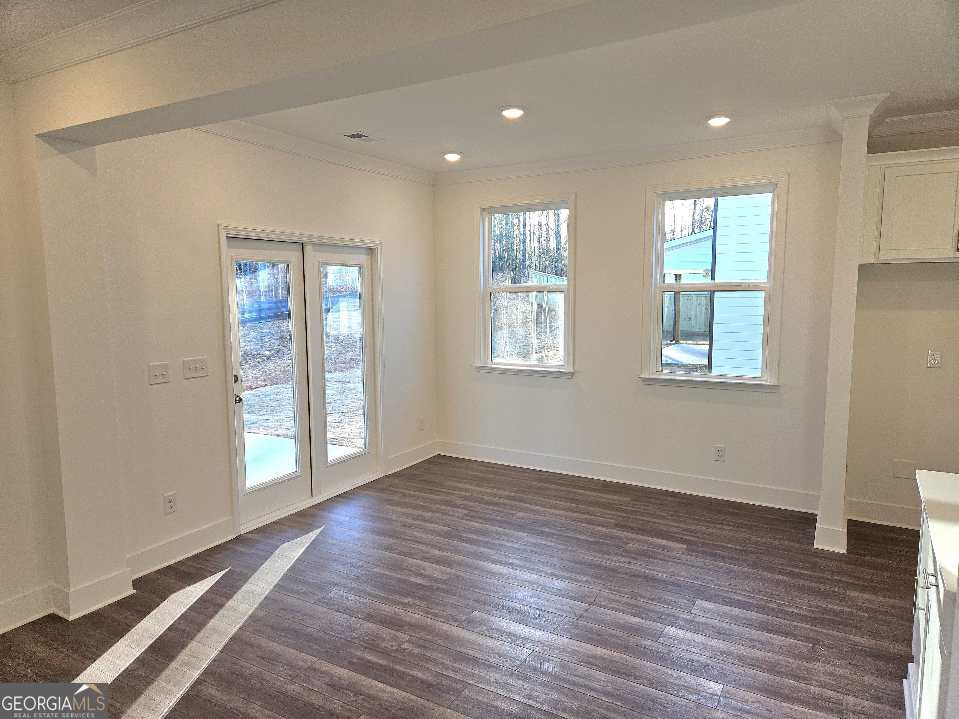 219 Andalusa Court Dallas, GA 30132 - Photo 15 of 50 a view of an empty room with wooden floor and a window