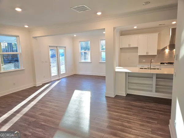 a room view with wooden floor and window