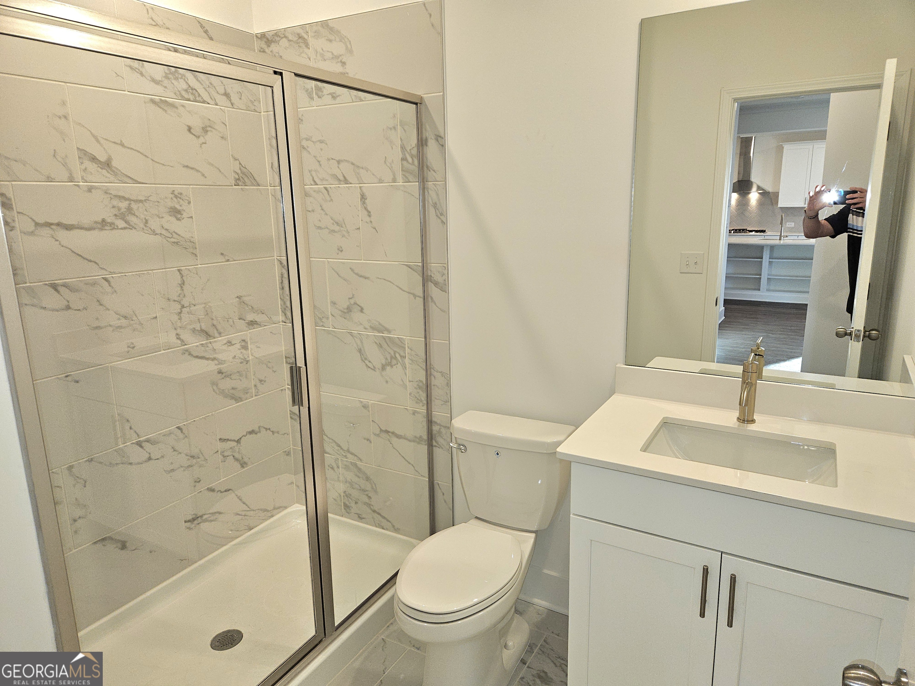 219 Andalusa Court Dallas, GA 30132 - Photo 19 of 50 a bathroom with a sink a toilet and shower