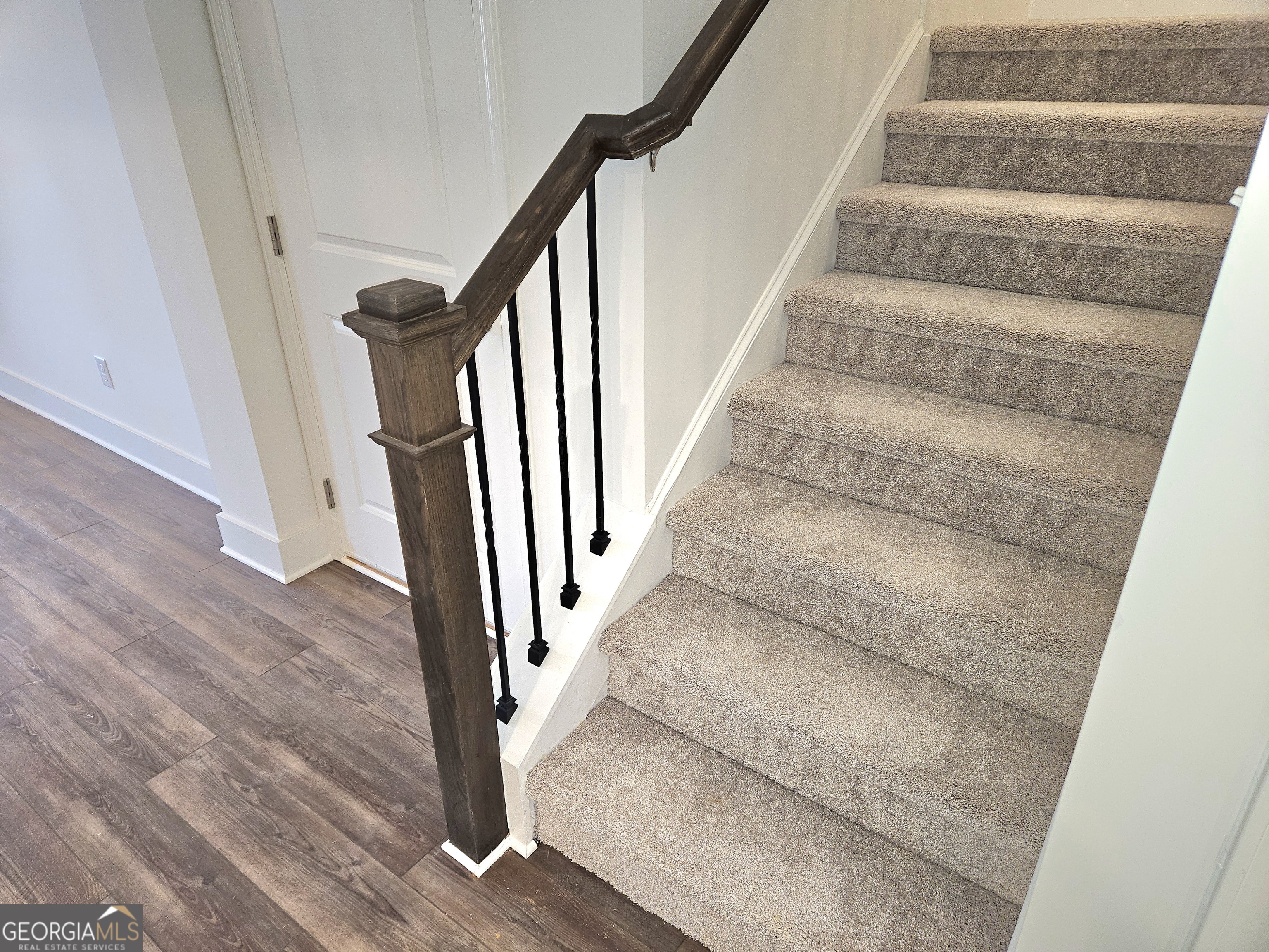 219 Andalusa Court Dallas, GA 30132 - Photo 26 of 50 a view of staircase with white walls and railing