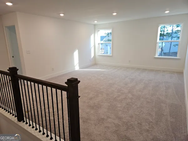 a view of hallway with windows