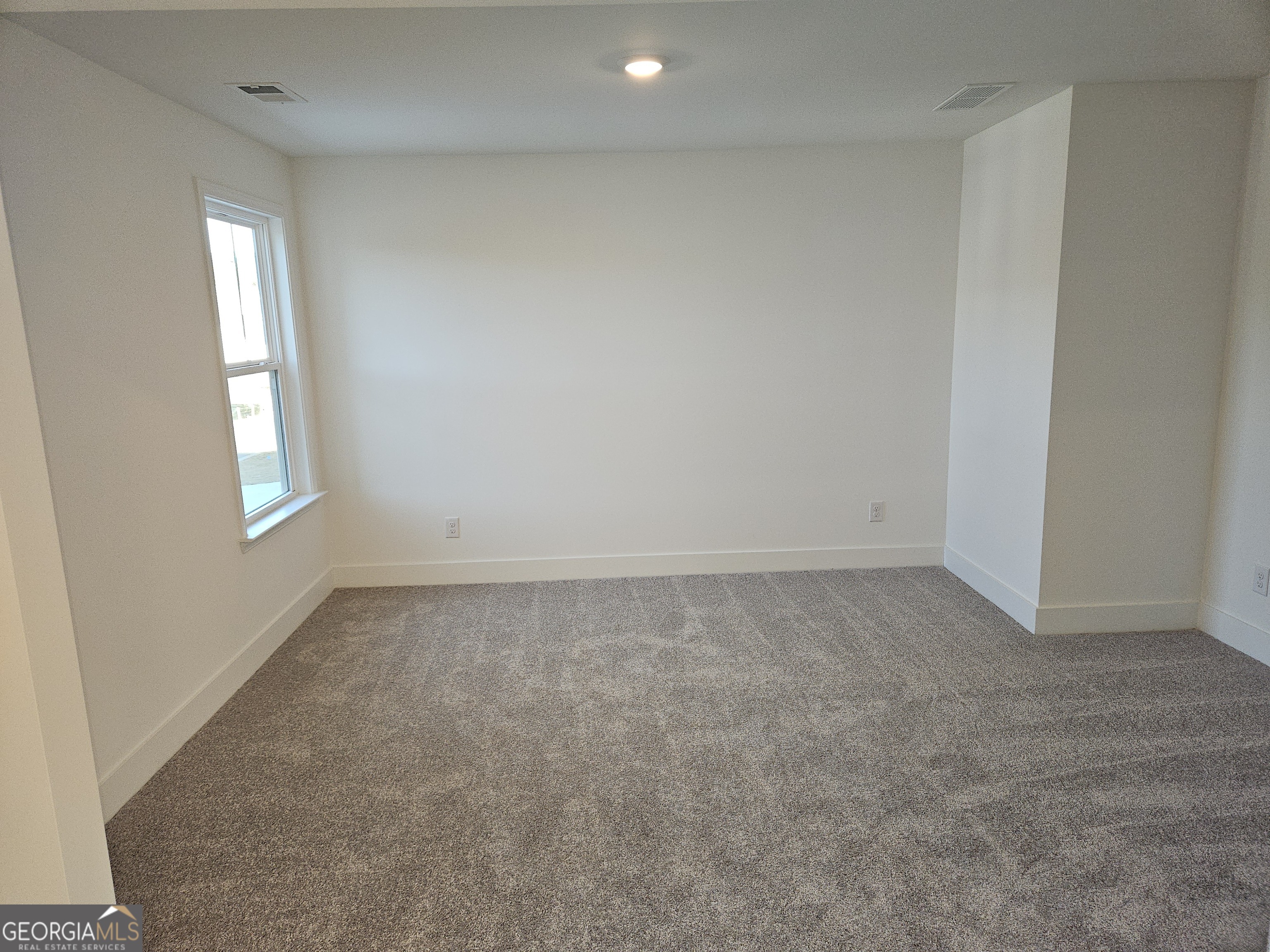 219 Andalusa Court Dallas, GA 30132 - Photo 32 of 50 an empty room with windows