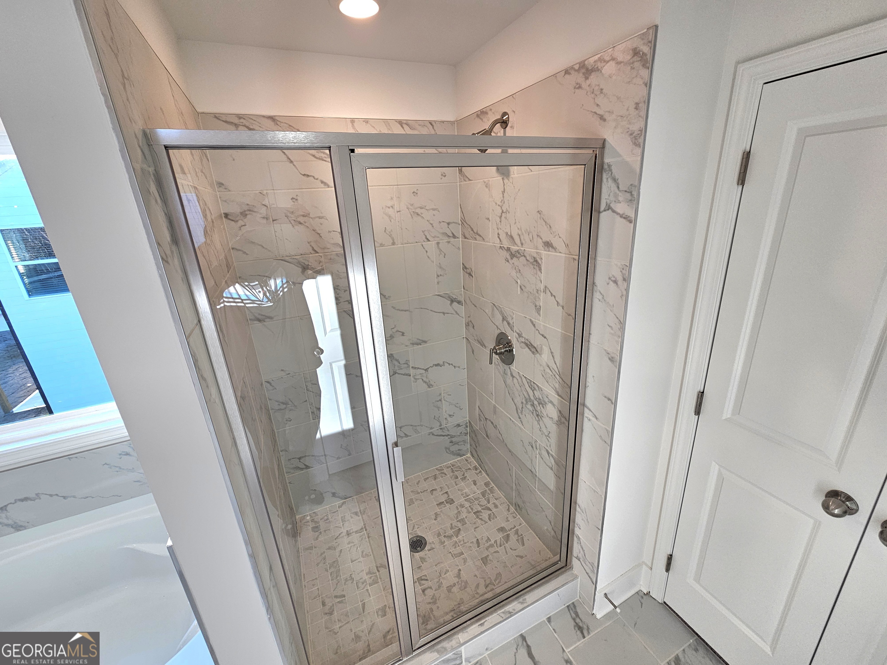 219 Andalusa Court Dallas, GA 30132 - Photo 34 of 50 a bathroom with a glass door shower and vanity