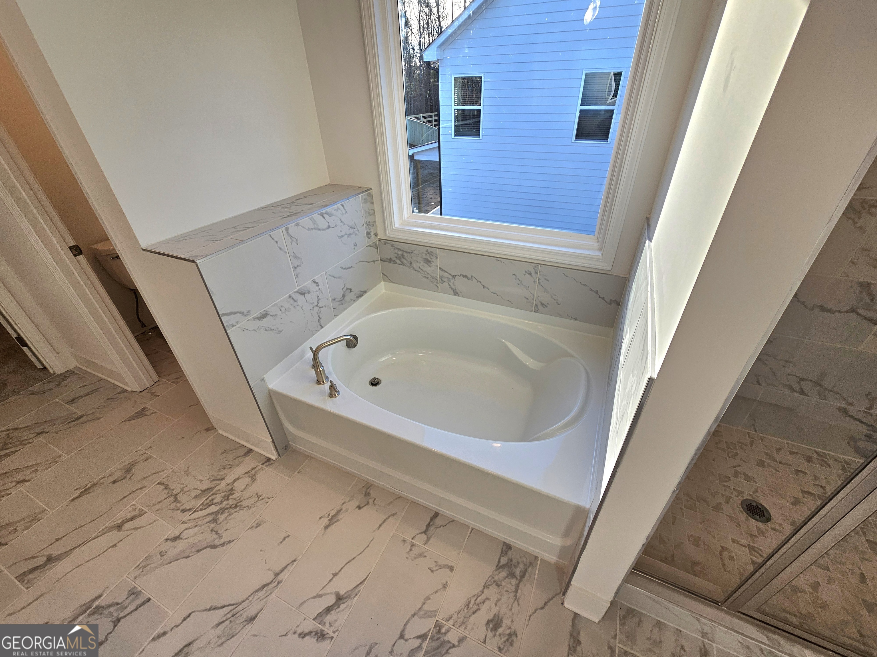 219 Andalusa Court Dallas, GA 30132 - Photo 35 of 50 a bathroom with a bathtub