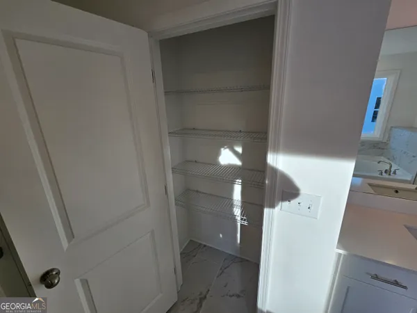 a bathroom with a sink and mirror