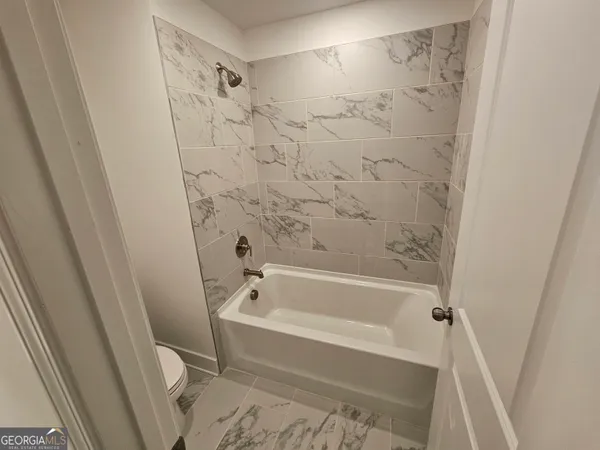 a bathroom with a double vanity sink and mirror