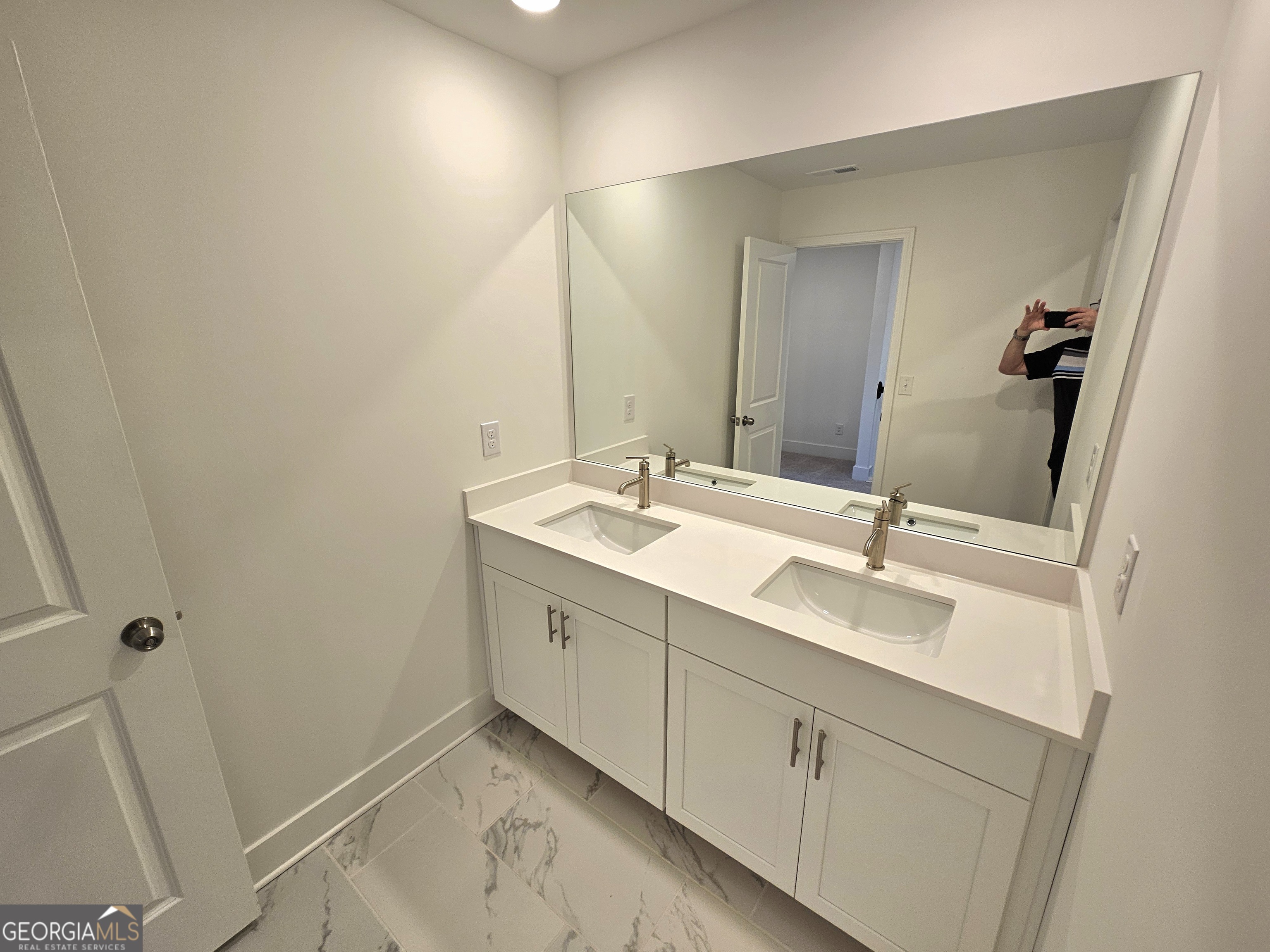 219 Andalusa Court Dallas, GA 30132 - Photo 47 of 50 a bathroom with a double vanity sink and mirror