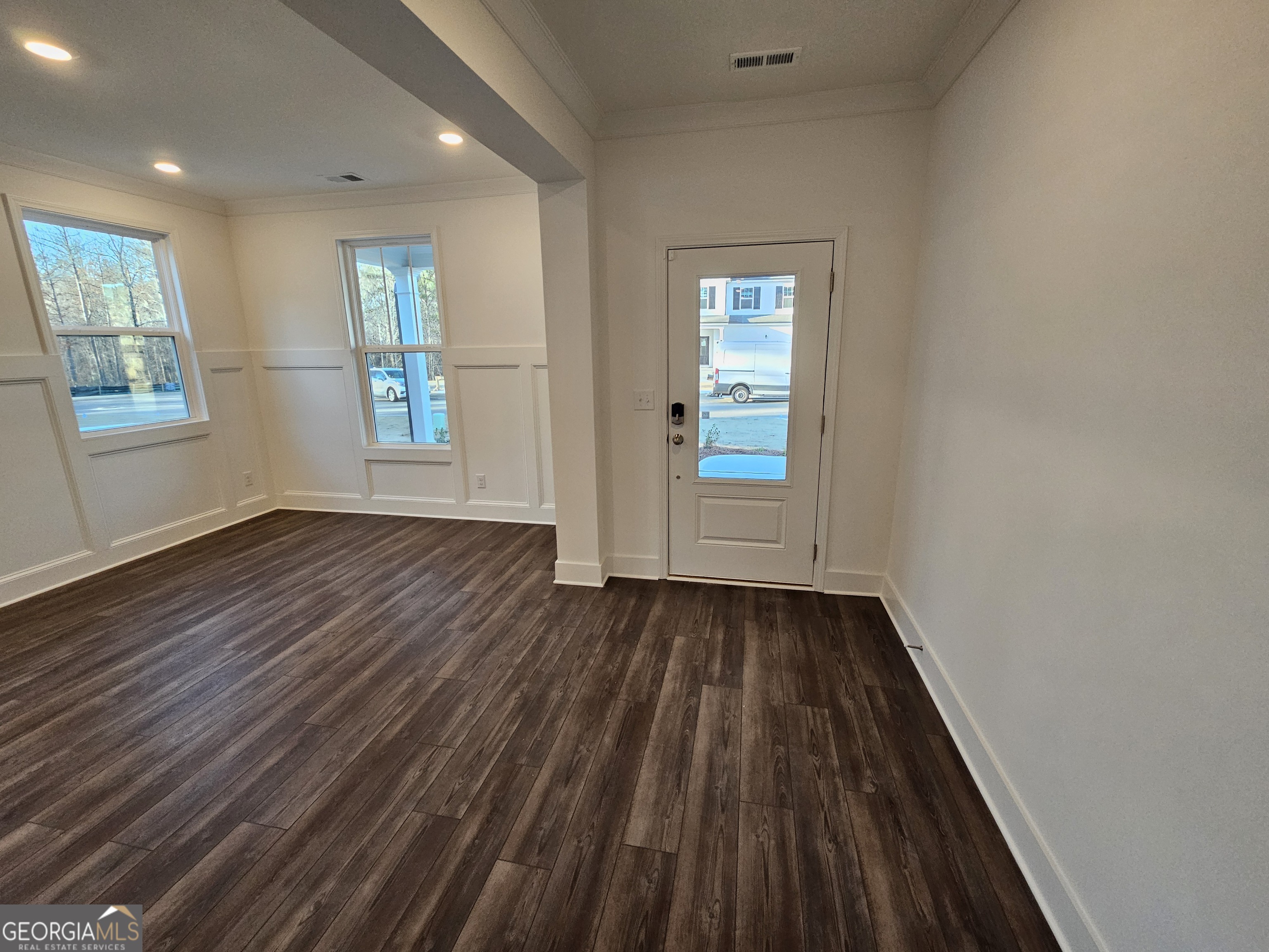 219 Andalusa Court Dallas, GA 30132 - Photo 48 of 50 an empty room with wooden floor and windows