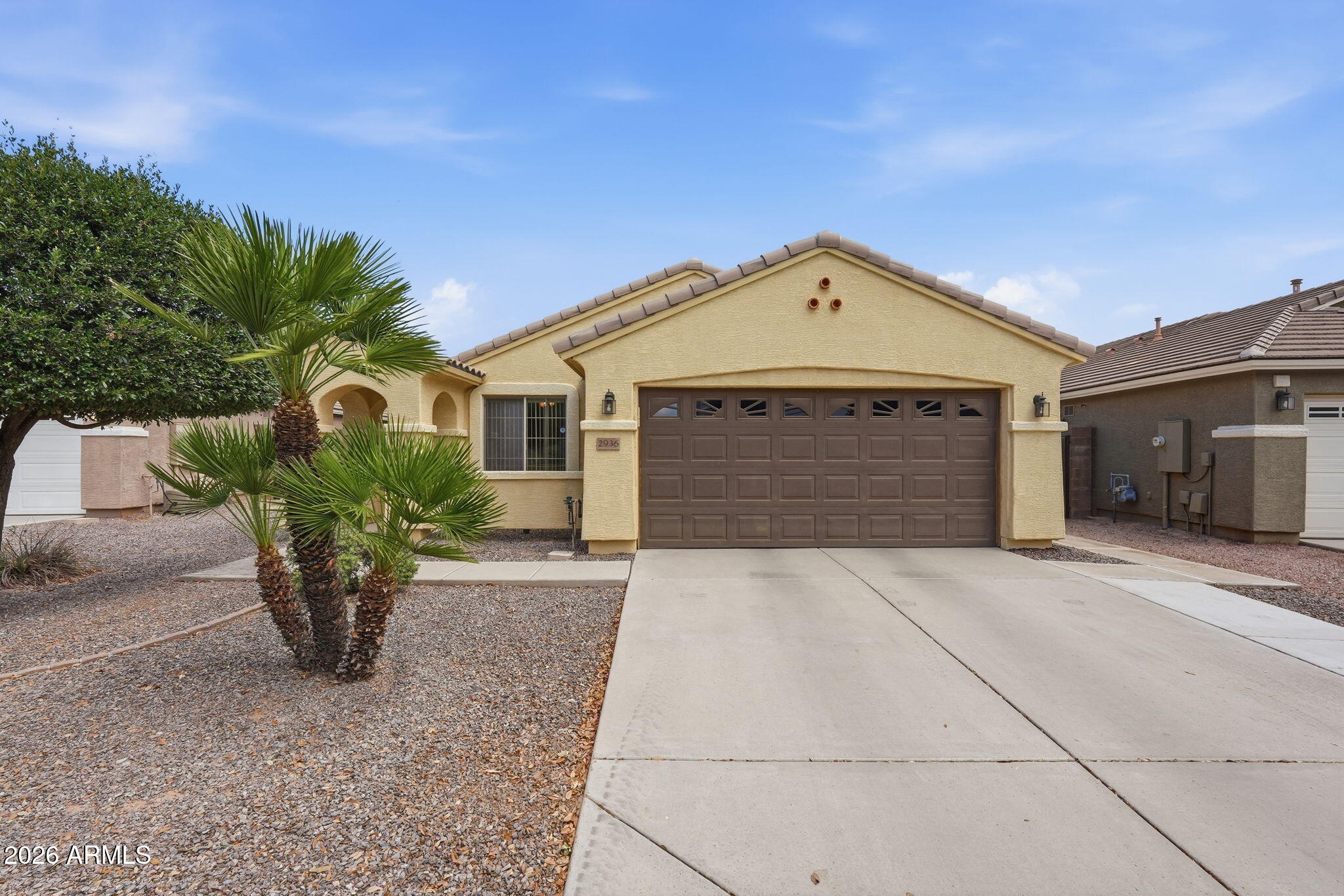 2936 East Crescent Way Gilbert, AZ 85298 - Photo 1 of 40 a front view of a house with garden