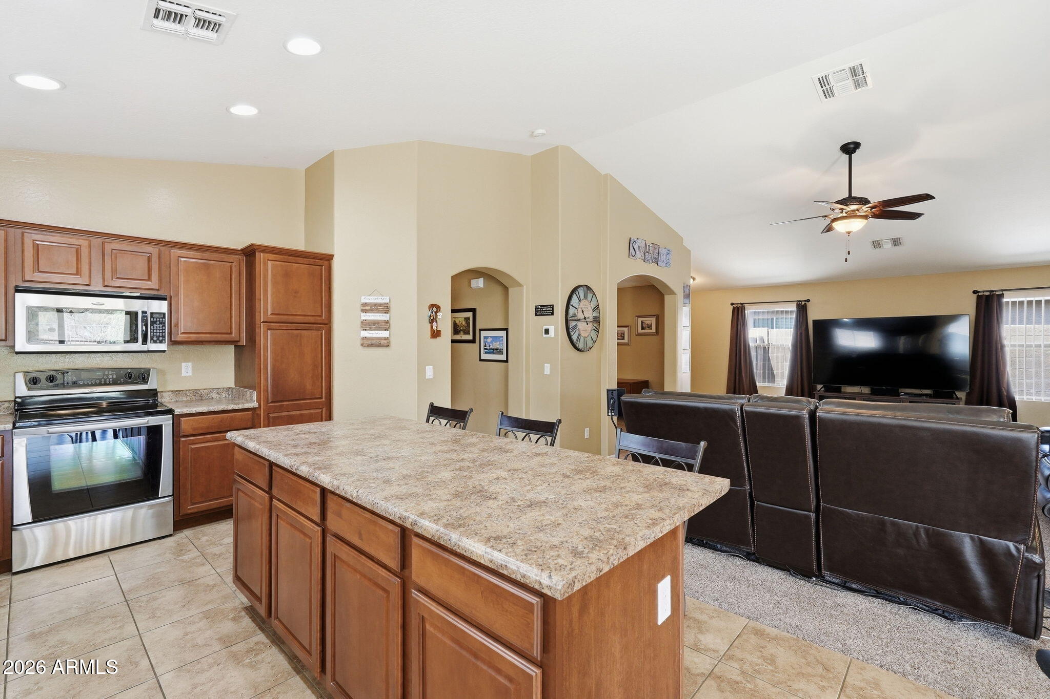 2936 East Crescent Way Gilbert, AZ 85298 - Photo 20 of 40 a kitchen with stainless steel appliances granite countertop a sink and a refrigerator