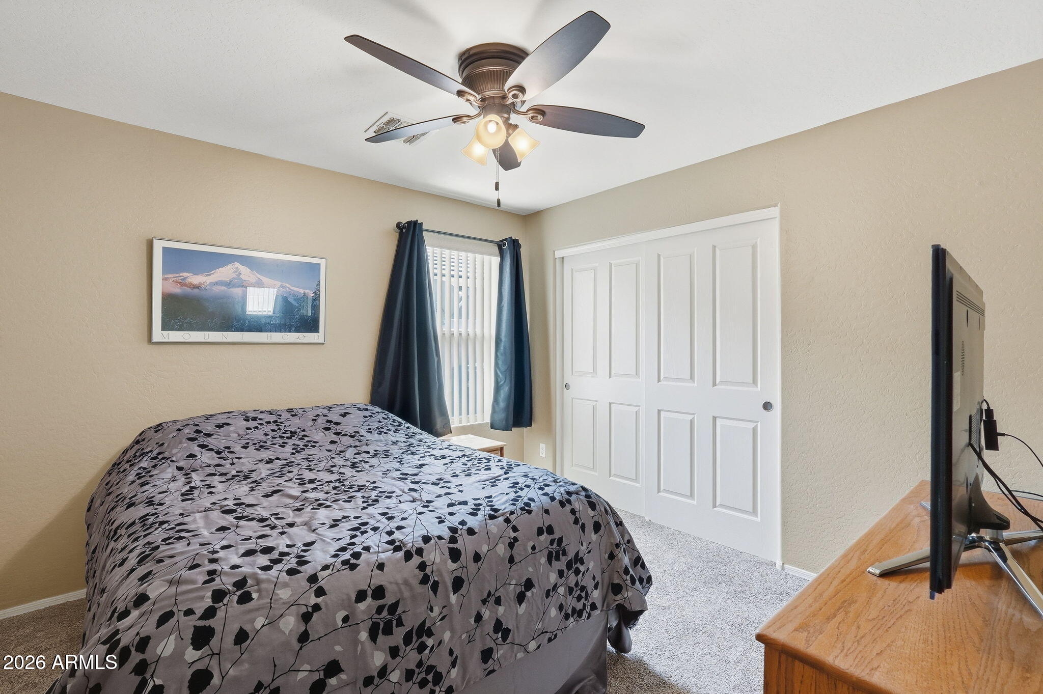 2936 East Crescent Way Gilbert, AZ 85298 - Photo 25 of 40 a bedroom with a bed and a chandelier