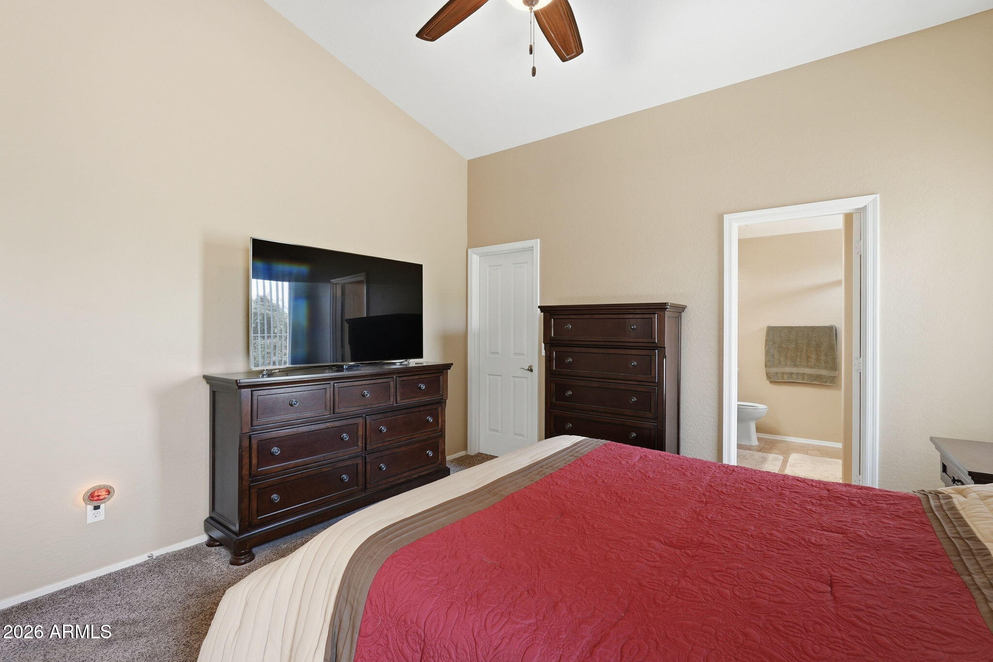 2936 East Crescent Way Gilbert, AZ 85298 - Photo 30 of 40 a bedroom with a bed and a flat tv screen on dresser