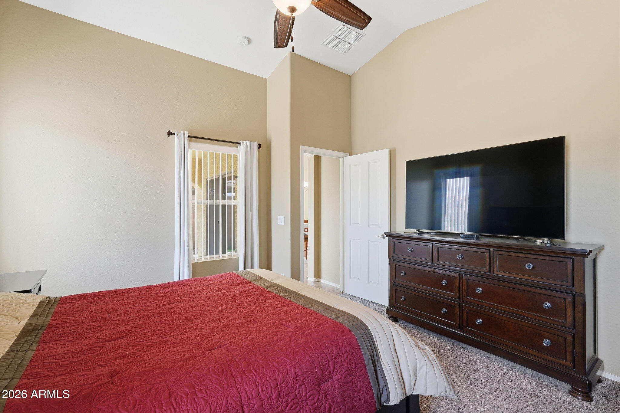 2936 East Crescent Way Gilbert, AZ 85298 - Photo 32 of 40 a bedroom with a bed and a flat screen tv
