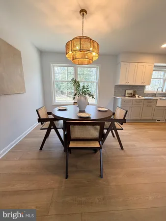 a kitchen with stainless steel appliances kitchen island granite countertop a sink and a refrigerator