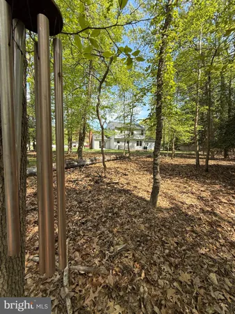a view of a backyard of the house