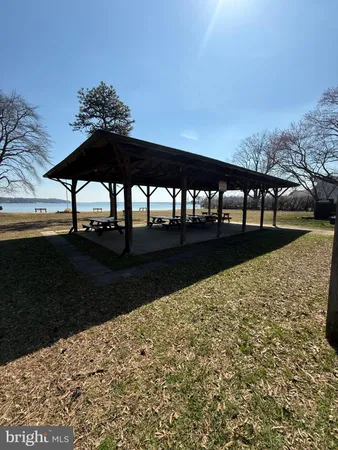 a view of a lake with houses in the back