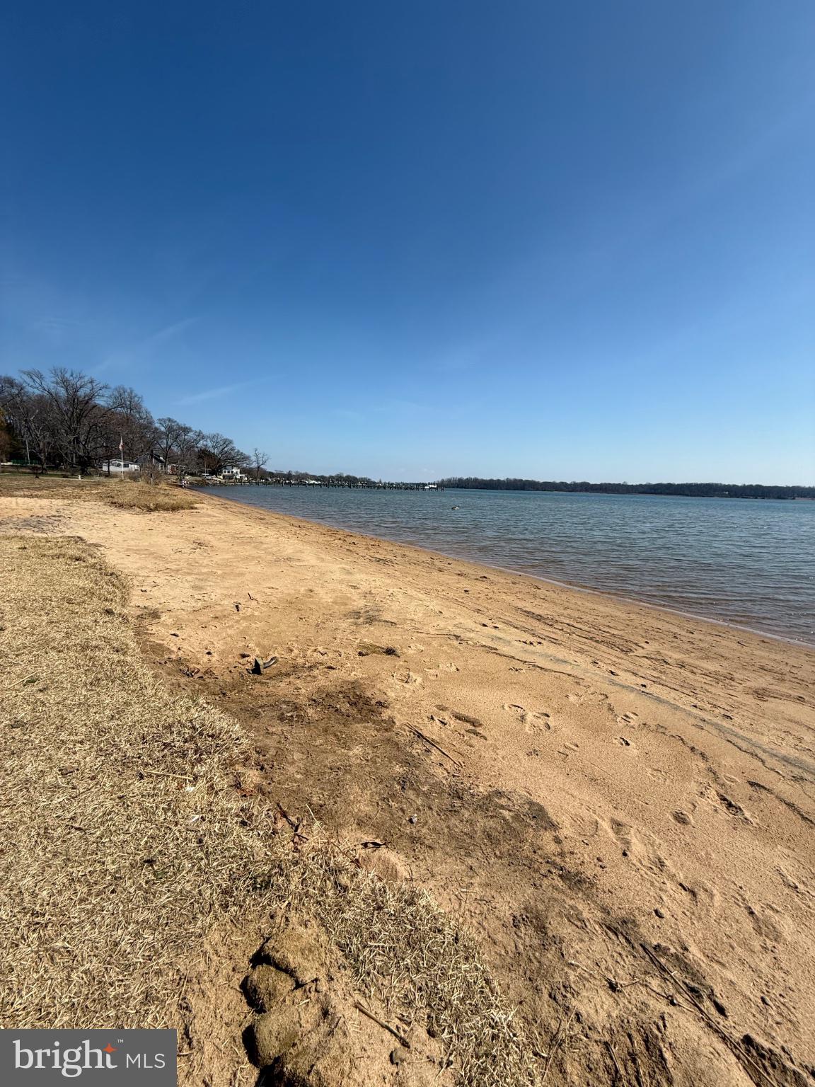 192 Hickory Point Road Pasadena, MD 21122 - Photo 52 of 53 Serene lakeside escape on a sunny day.