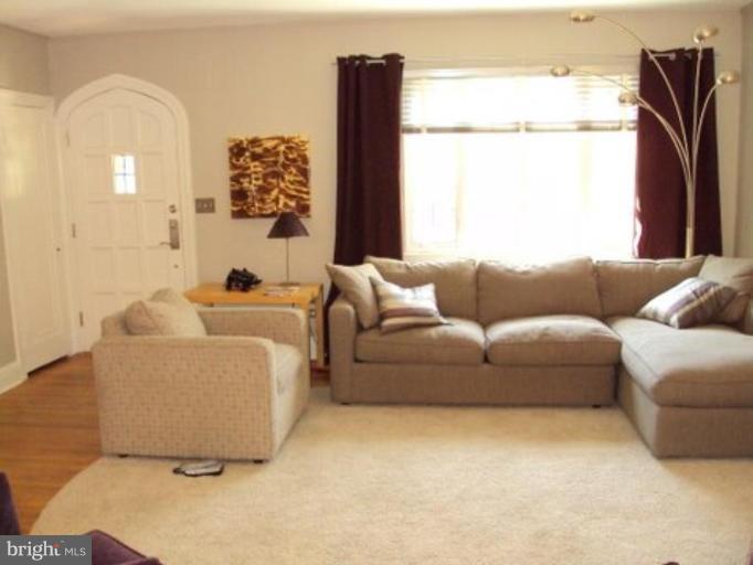 3721 Rexmere Road Baltimore, MD 21218 - Photo 3 of 18 a living room with furniture and a large window