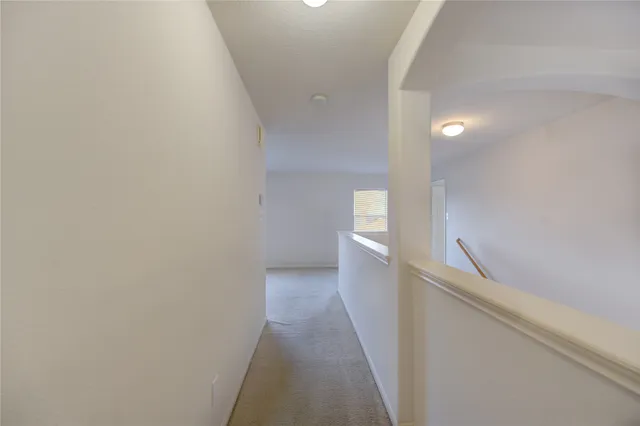 a view of empty room with windows