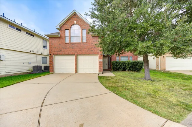 a house view with a garden space