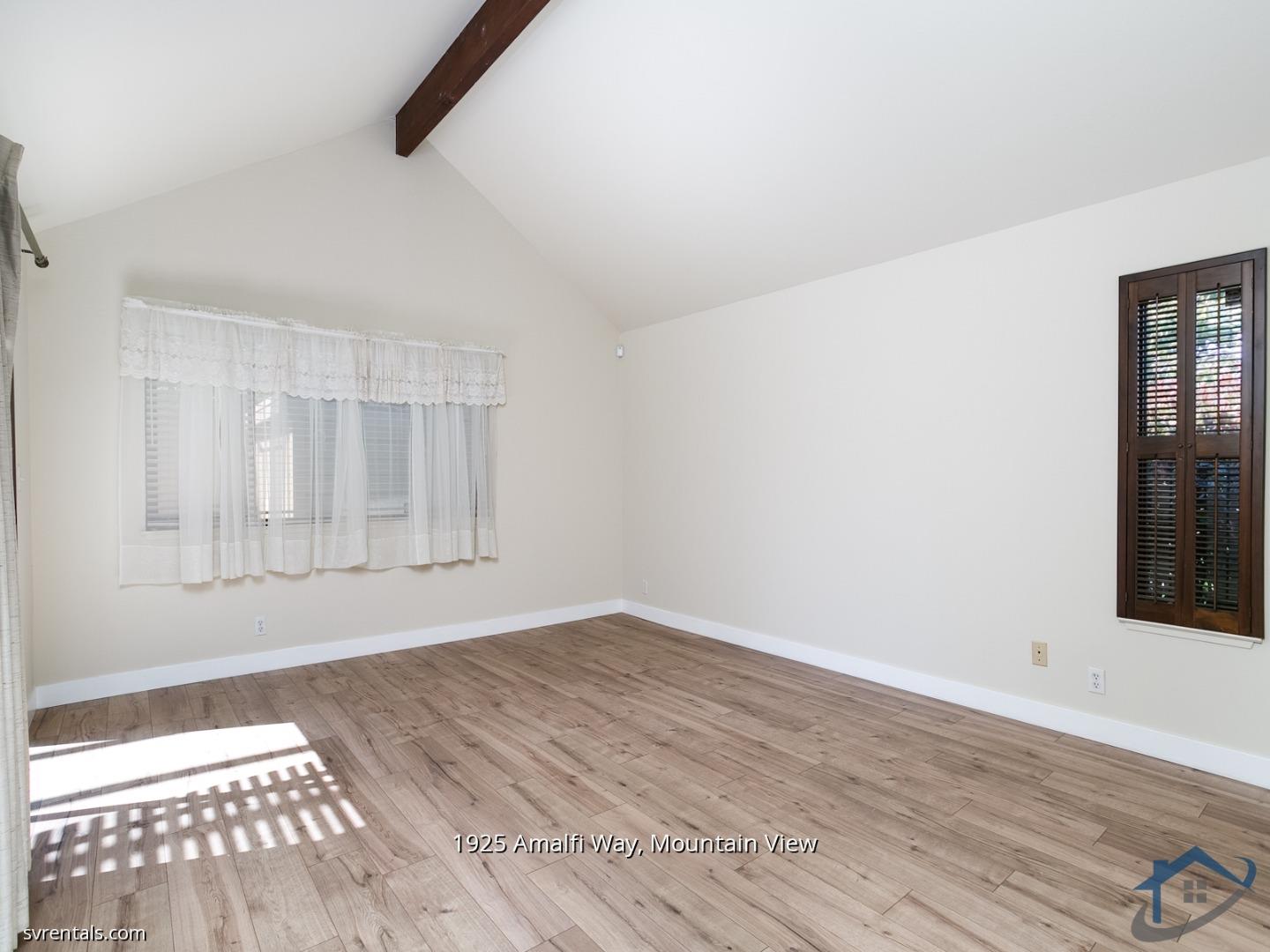 1925 Amalfi Way Mountain View, CA 94040 - Photo 11 of 23 an empty room with wooden floor and windows