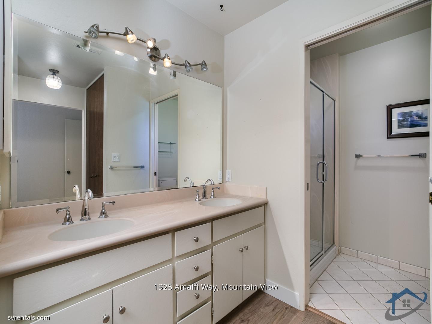 1925 Amalfi Way Mountain View, CA 94040 - Photo 18 of 23 a bathroom with a double vanity sink and a mirror
