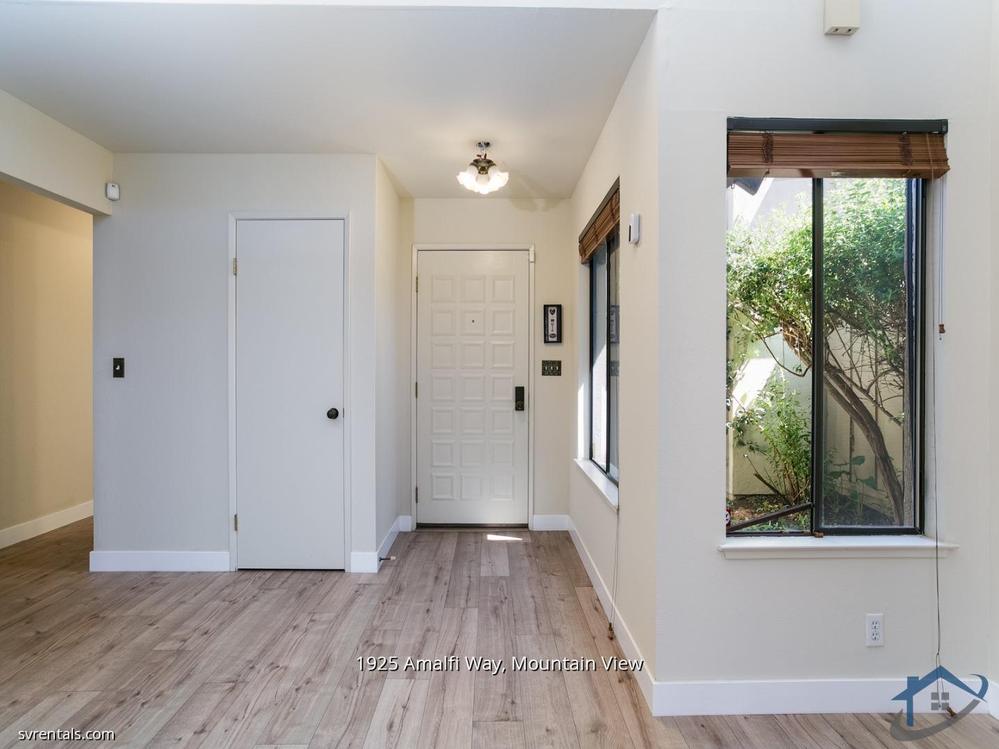 1925 Amalfi Way Mountain View, CA 94040 - Photo 4 of 23 a view of a hallway with wooden floor and a window