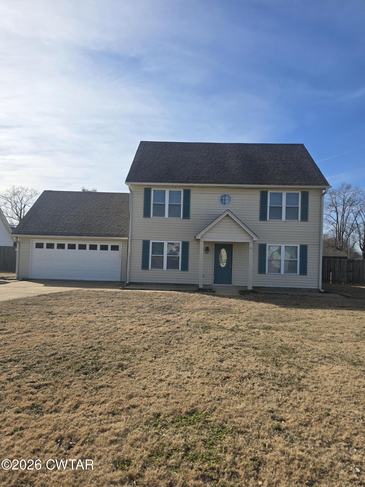 157 Dustin Drive Jackson, TN 38301 - Photo 1 of 22 a house with yard in front of it