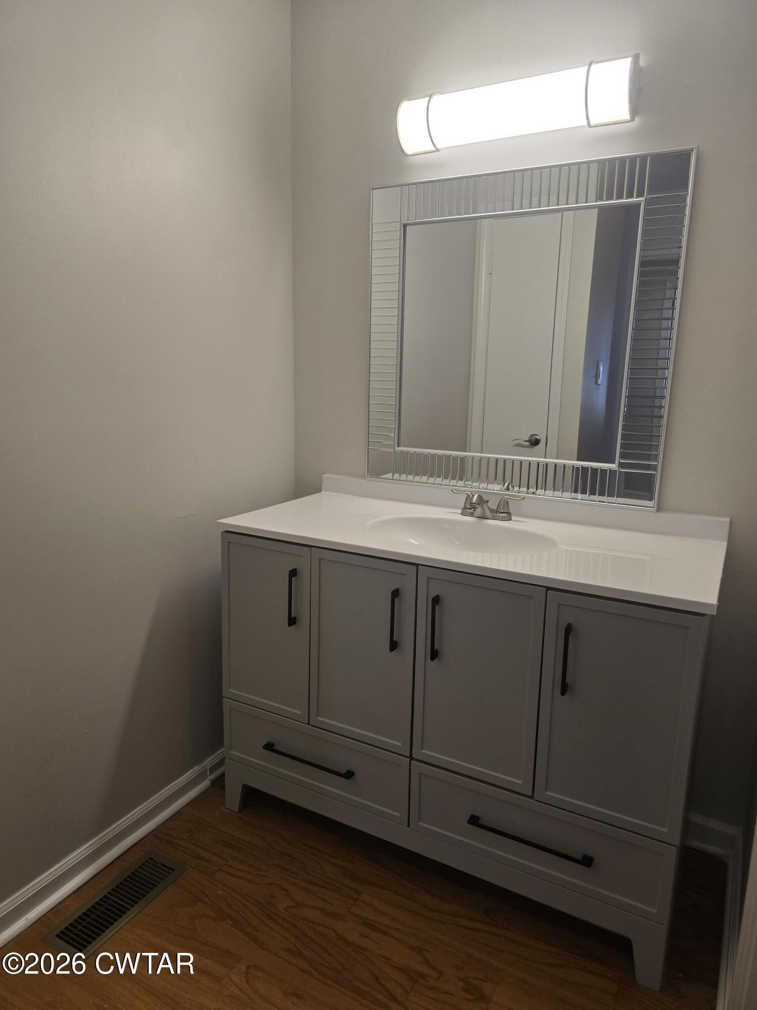 157 Dustin Drive Jackson, TN 38301 - Photo 15 of 22 a bathroom with a sink a vanity and a mirror