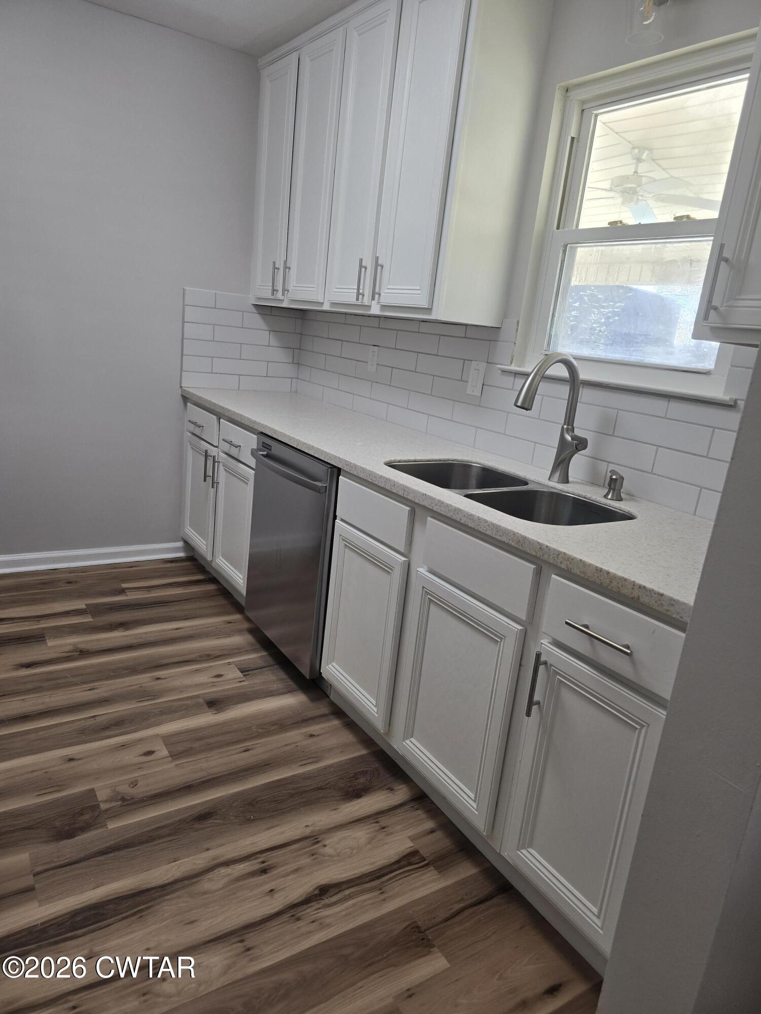 157 Dustin Drive Jackson, TN 38301 - Photo 3 of 22 a kitchen with a sink and cabinets
