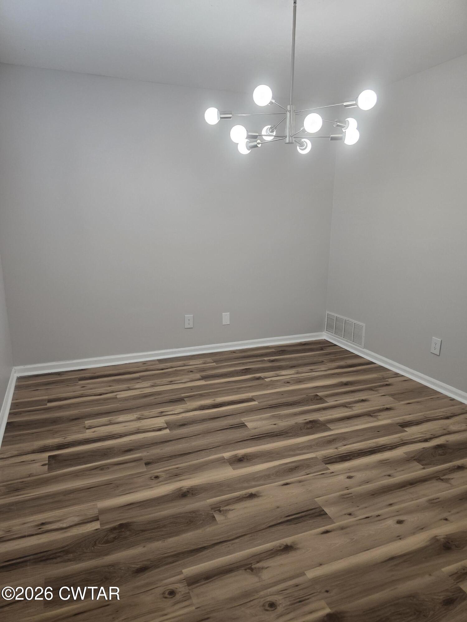 157 Dustin Drive Jackson, TN 38301 - Photo 5 of 22 a view of room with window and hardwood floor