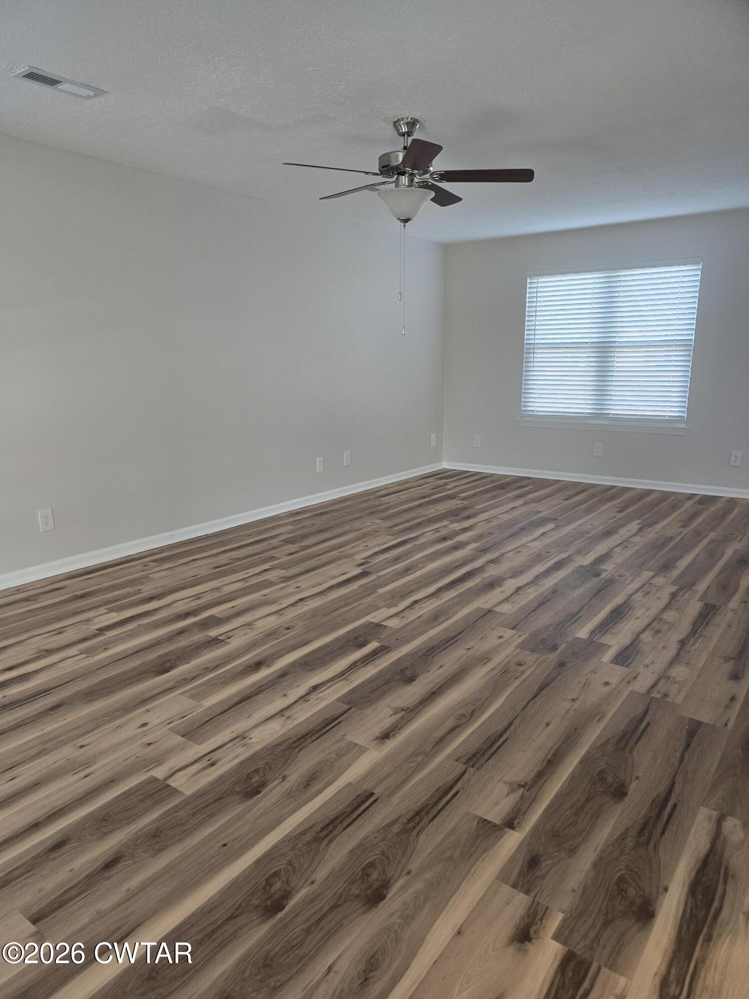 157 Dustin Drive Jackson, TN 38301 - Photo 7 of 22 a view of an empty room with a window