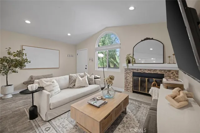 a living room with furniture and a fireplace