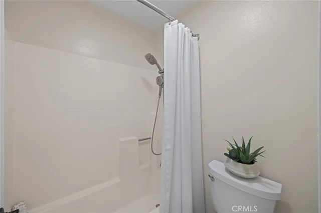 a bathroom with a shower curtain