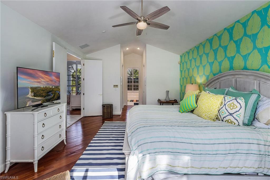 720 Turkey Oak Lane Naples, FL 34108 - Photo 15 of 31 Primary Bedroom/King Bed
