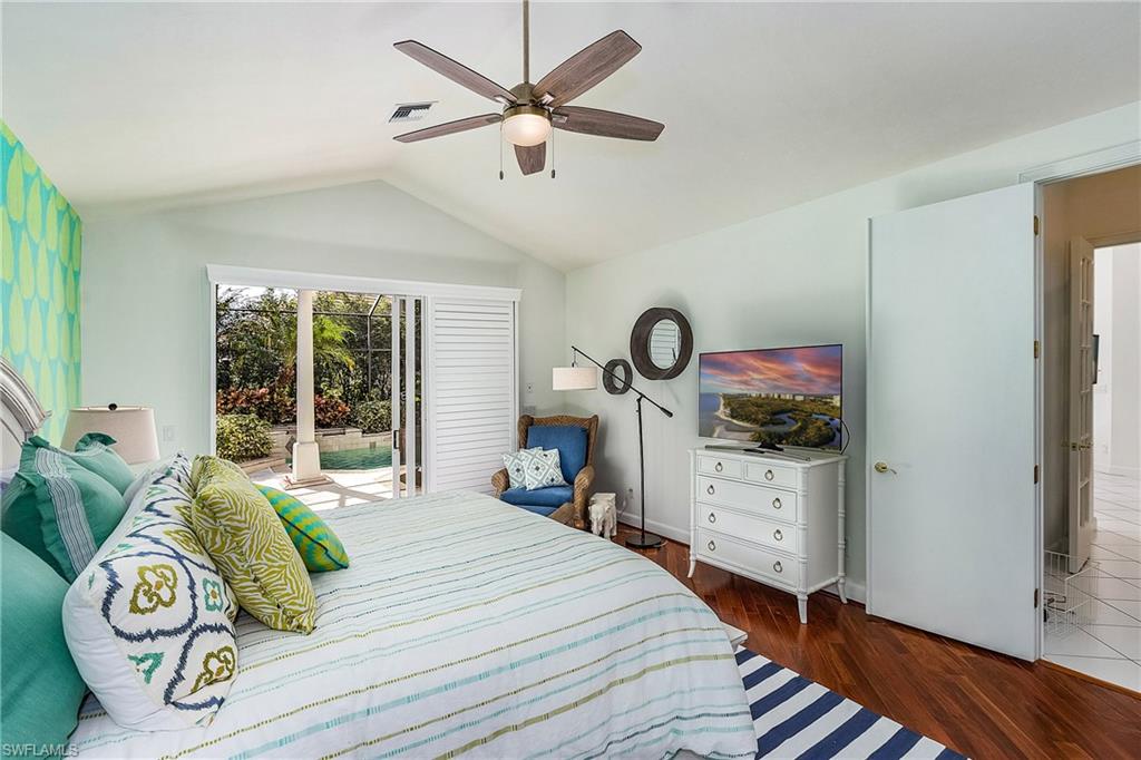 720 Turkey Oak Lane Naples, FL 34108 - Photo 17 of 31 Primary Bedroom/King Bed