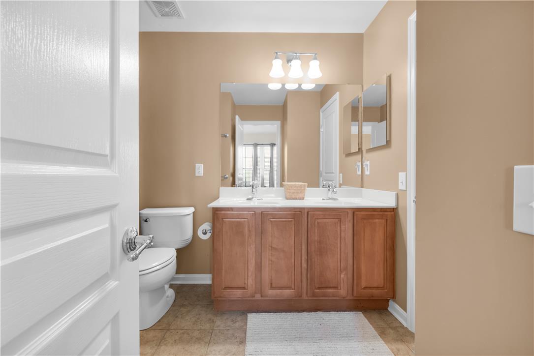 1709 Travers Road Breinigsville, PA 18031 - Photo 37 of 55 Double vanity with ample storage complements this well-appointed bathroom.