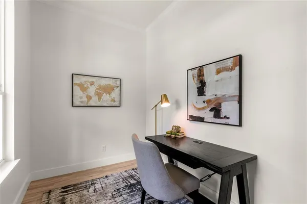 a open kitchen with stainless steel appliances granite countertop a stove oven a sink dishwasher and a fireplace with wooden floor