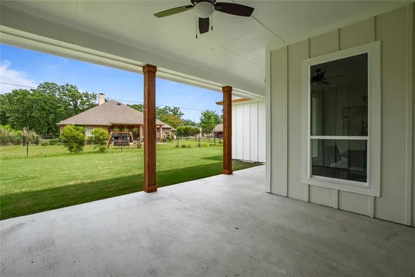 a view of a swimming pool with a patio