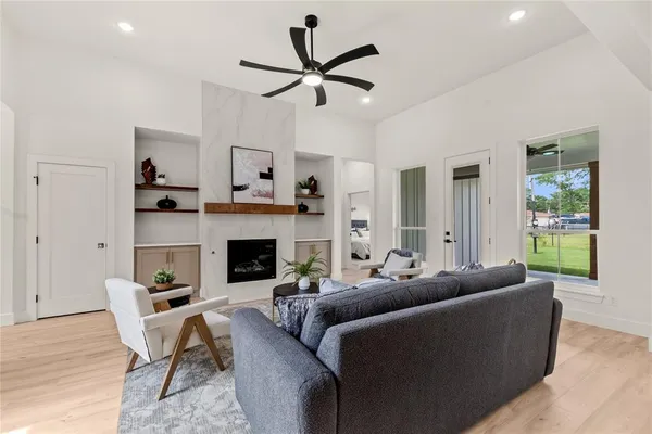 a living room with furniture and a fireplace