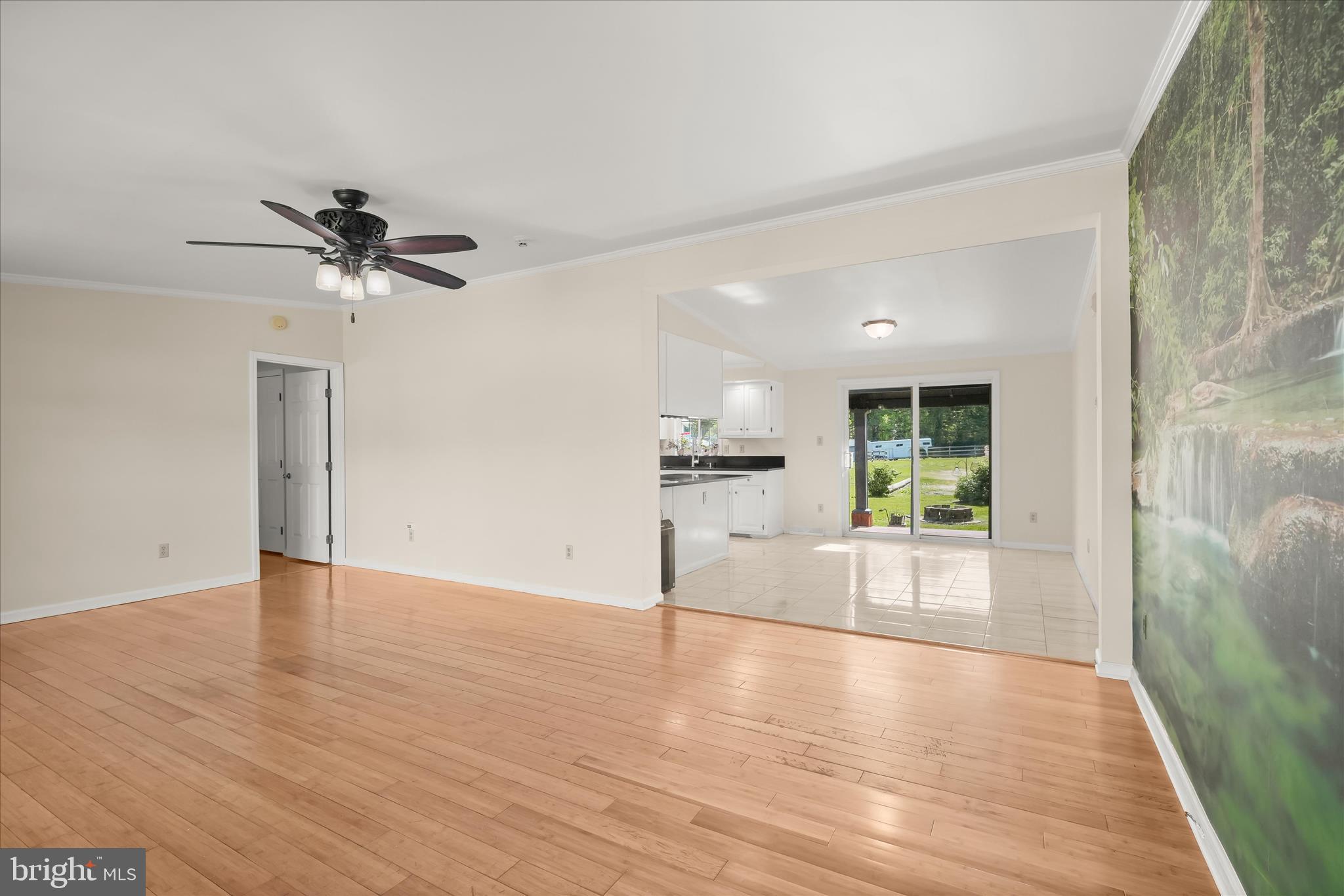 3325 Allday Road Huntingtown, MD 20639 - Photo 11 of 77 a view of a livingroom with a ceiling fan and a rug