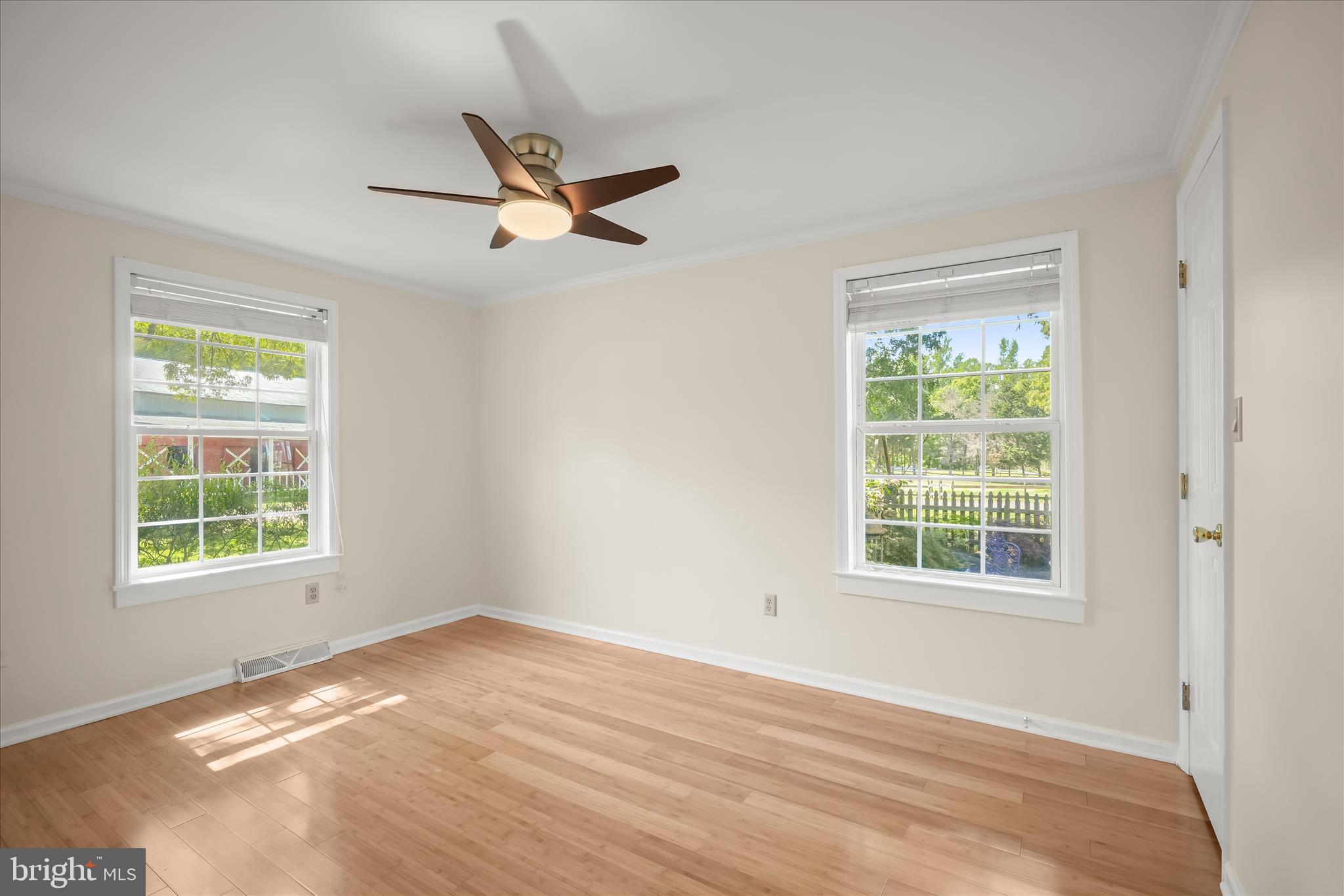 3325 Allday Road Huntingtown, MD 20639 - Photo 27 of 77 an empty room with a window and a ceiling fan